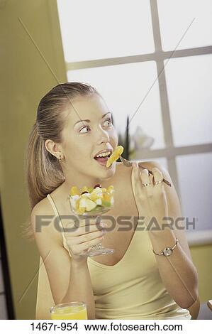 people, eating, woman, fruit, blond, food, hungry View Large Photo Image Picture - people, eating, woman, fruit, blond, food, hungry. Fotosearch