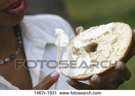 people, eating, woman, healthy, knife, bagel View Large Photo Image Stock Image - people, eating, woman, healthy, knife, bagel. Fotosearch