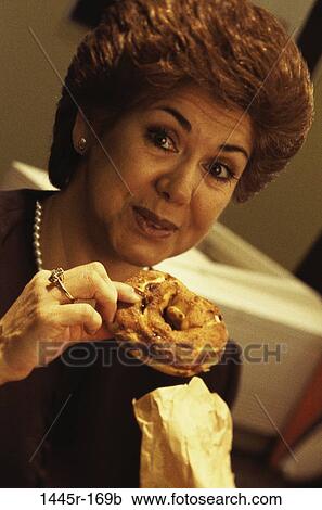 people, eating, woman, Hispanic, breakfast, Middle-aged, snack View Large Photo Image Stock Image - people, eating, woman, Hispanic, breakfast, Middle-aged, snack. Fotosearch