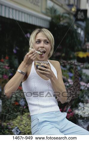 people, eating, woman, outdoors, blond, food, hungry View Large Photo Image Stock Photo - people, eating, woman, outdoors, blond, food, hungry. Fotosearch