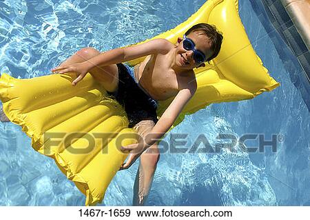 people, floating, water, pool, smiling, boy View Large Photo Image Stock Photo - people, floating, water, pool, smiling, boy. Fotosearch