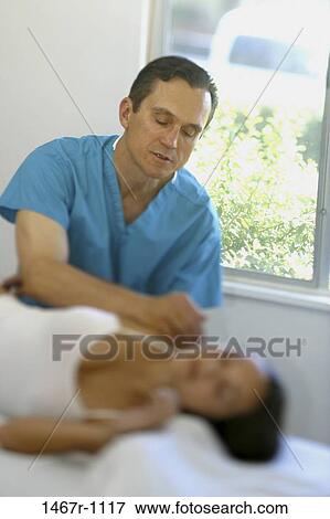 Stock Photo - people, health, personnel, medical, indoors, massage. Fotosearch