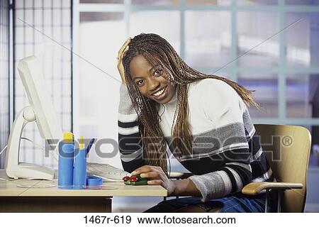 people, home, woman, computer, indoors, African-American View Large Photo Image Stock Photo - people, home, woman, computer, indoors, African-American. Fotosearch