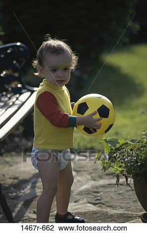 Stock Image - people, playing, baby, ball, outdoors, play, toy. Fotosearch