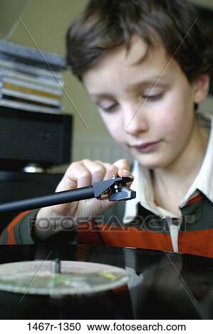 Stock Image - people, playing, music, boy, entertainment, child, play. Fotosearch