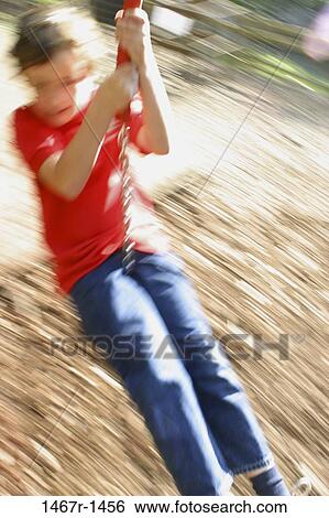 people, playing, swinging, swing, boy, motion, outdoors View Large Photo Image Stock Photograph - people, playing, swinging, swing, boy, motion, outdoors. Fotosearch