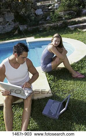 people, pool, couple, computer, laptop, outdoors, swimming pool View Large Photo Image Stock Image - people, pool, couple, computer, laptop, outdoors, swimming pool. Fotosearch