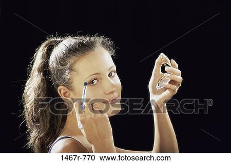 Stock Image - people, reflection, eye, black, shadow, Hispanic. Fotosearch