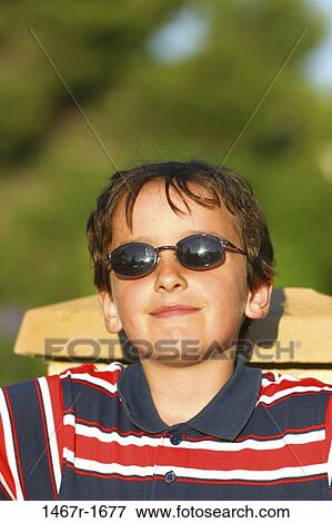 people, reflection, relaxation, smiling, chair, sitting, sunglasses View Large Photo Image Stock Photo - people, reflection, relaxation, smiling, chair, sitting, sunglasses. Fotosearch