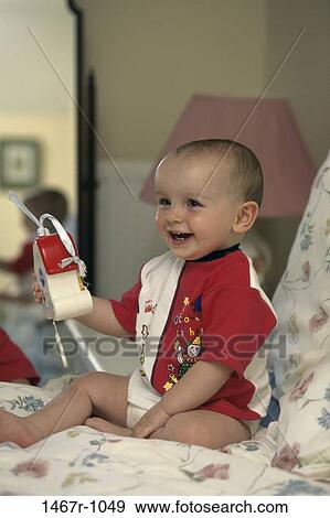people, smiling, sitting, Hispanic, baby, laughing, holding View Large Photo Image Stock Photo - people, smiling, sitting, Hispanic, baby, laughing, holding. Fotosearch