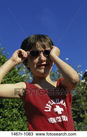 people, smiling, sunglasses, boy, outdoors, wearing View Large Photo Image Stock Image - people, smiling, sunglasses, boy, outdoors, wearing. Fotosearch