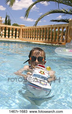 people, swim, water, pool, playing, swimming, boy View Large Photo Image Stock Image - people, swim, water, pool, playing, swimming, boy. Fotosearch