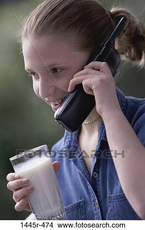 people, telephone, listening, milk, phone, drinking, girl View Large Photo Image Picture - people, telephone, listening, milk, phone, drinking, girl. Fotosearch