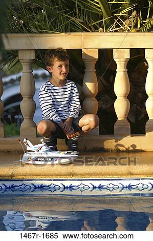 people, water, pool, smiling, railing, beach, boy View Large Photo Image Stock Photography - people, water, pool, smiling, railing, beach, boy. Fotosearch