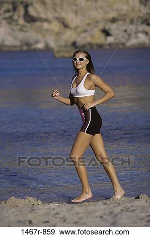 people, water, running, ripples, woman, smiling, walking View Large Photo Image Stock Photo - people, water, running, ripples, woman, smiling, walking. Fotosearch