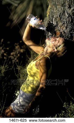 Stock Photography - people, water, woman, bottle, pouring, drinking, outdoors. Fotosearch