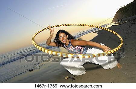 people, woman, beach, motion, individuality, twirling View Large Photo Image Stock Photo - people, woman, beach, motion, individuality, twirling. Fotosearch
