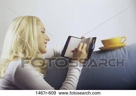 people, woman, blond, indoors, diary, Caucasian View Large Photo Image Stock Photo - people, woman, blond, indoors, diary, Caucasian. Fotosearch