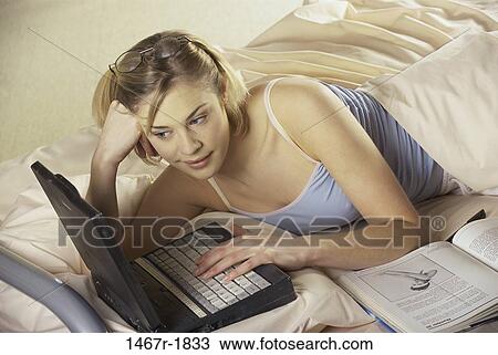 people, woman, computer, laptop, bed, book View Large Photo Image Stock Image - people, woman, computer, laptop, bed, book. Fotosearch