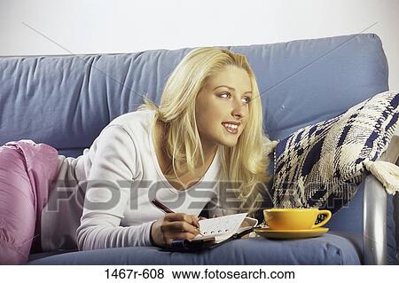 people, woman, couch, blond, indoors, diary View Large Photo Image Stock Photo - people, woman, couch, blond, indoors, diary. Fotosearch