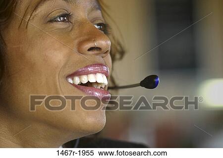 people, woman, headset, smiling, nose, business View Large Photo Image Stock Photography - people, woman, headset, smiling, nose, business. Fotosearch