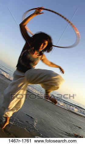 people, woman, Hispanic, beach, motion, twirling, tide View Large Photo Image Stock Image - people, woman, Hispanic, beach, motion, twirling, tide. Fotosearch
