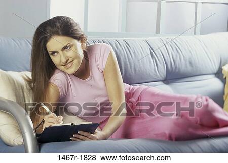 people, woman, planner, notebook, couch, creative View Large Photo Image Stock Photo - people, woman, planner, notebook, couch, creative. Fotosearch