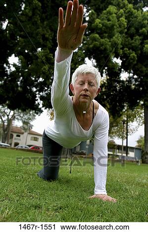 people, woman, senior, calm, stretching, health, outdoors View Large Photo Image Stock Image - people, woman, senior, calm, stretching, health, outdoors. Fotosearch