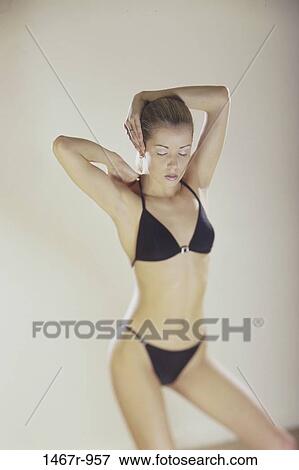 Stock Photo - people, woman, serious, blond, posing, indoors. Fotosearch