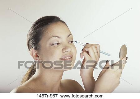people, woman, smiling, Hispanic, concentrating, makeup View Large Photo Image Stock Photo - people, woman, smiling, Hispanic, concentrating, makeup. Fotosearch