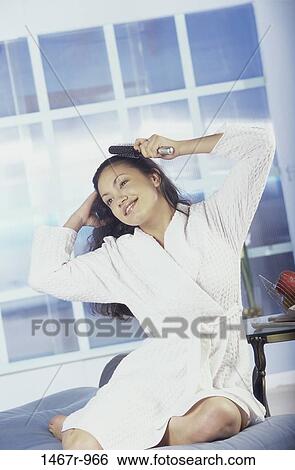 people, woman, smiling, sitting, Hispanic, brushing, smile View Large Photo Image Stock Photograph - people, woman, smiling, sitting, Hispanic, brushing, smile. Fotosearch