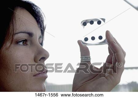 people, woman, staring, holding, concentrating, looking View Large Photo Image Stock Photograph - people, woman, staring, holding, concentrating, looking. Fotosearch