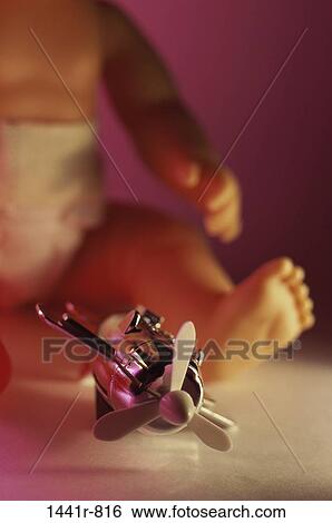 propeller, baby, still life, toys, doll, airplane View Large Photo Image Stock Photograph - propeller, baby, still life, toys, doll, airplane. Fotosearch
