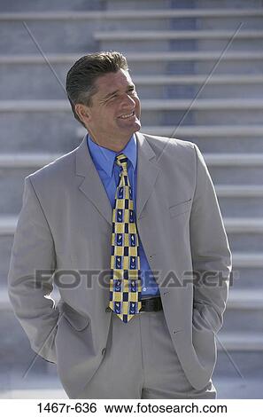 Stock Photograph - reflection, steps, stairs, smiling, suit, business. Fotosearch