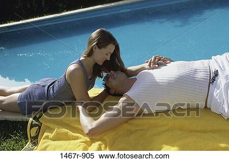 relaxed, people, pool, couple, poolside, relaxing, towel View Large Photo Image Stock Photography - relaxed, people, pool, couple, poolside, relaxing, towel. Fotosearch