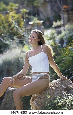 rock, relaxed, people, woman, sitting, outdoors, relaxing View Large Photo Image Stock Image - rock, relaxed, people, woman, sitting, outdoors, relaxing. Fotosearch