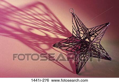 shadow, Christmas, festive, ornament, star, still life View Large Photo Image Stock Photograph - shadow, Christmas, festive, ornament, star, still life. Fotosearch