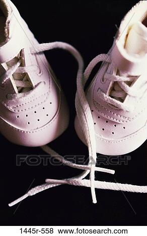Stock Photo - small, overhead, baby, shoes, still life, symbolic. Fotosearch