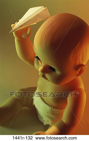 still life, paper, holding, doll, baby, toy, airplane View Large Photo Image Stock Image - still life, paper, holding, doll, baby, toy, airplane. Fotosearch