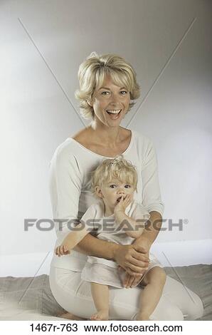 white, people, sitting, mother, baby, laughing, holding View Large Photo Image Stock Image - white, people, sitting, mother, baby, laughing, holding. Fotosearch