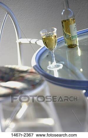 glass, table, chair, bottle, outdoors, alcoholic, alcohol View Large Photo Image Stock Photo - glass, table, chair, bottle, outdoors, alcoholic, alcohol. Fotosearch