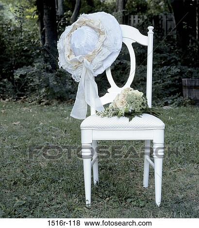 hat, chair, flowers, outdoors, furniture, bouquet, still life View Large Photo Image Stock Photo - hat, chair, flowers, outdoors, furniture, bouquet, still life. Fotosearch
