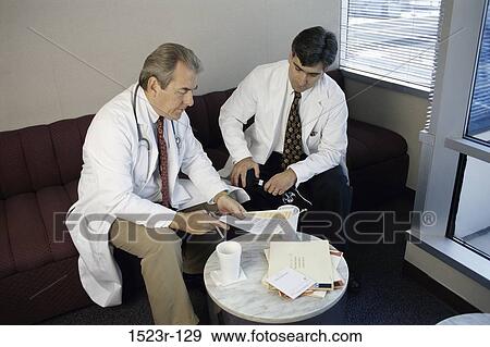 Stock Photo - men, talking, discussion, conversation, health, Middle-aged. Fotosearch