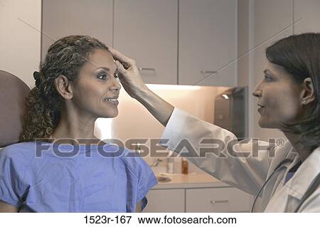 Stock Photo - multiethnic, consultation, talking, conversation, patient, doctor. Fotosearch