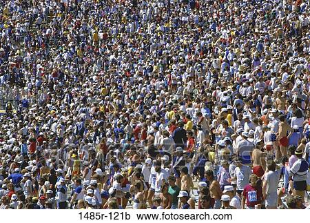 Stock Image - multiethnic, people, crowded, watch, large, standing, watching. Fotosearch