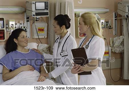 Stock Photo - multiethnic, talking, conversation, patient, doctor, nurse. Fotosearch