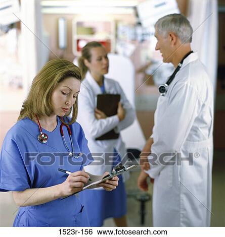 Stock Photograph - multiethnic, talking, discussion, conversation, nurse, chart, health. Fotosearch