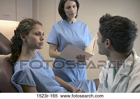 Stock Photography - multiethnic, talking, discussion, conversation, patient, doctor. Fotosearch