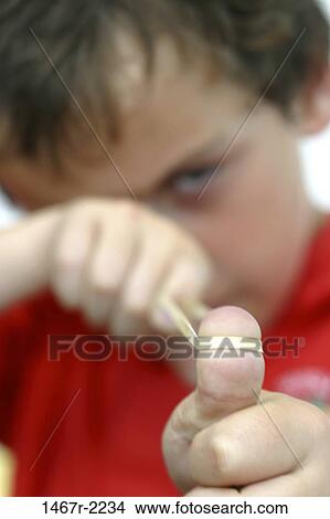 people, eye, thumb, boy, accuracy, child, mischievous View Large Photo Image Picture - people, eye, thumb, boy, accuracy, child, mischievous. Fotosearch