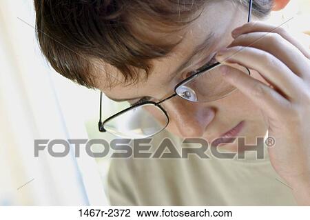 people, eyeglasses, concentration, concentrating, boy, contemplation View Large Photo Image Stock Image - people, eyeglasses, concentration, concentrating, boy, contemplation. Fotosearch